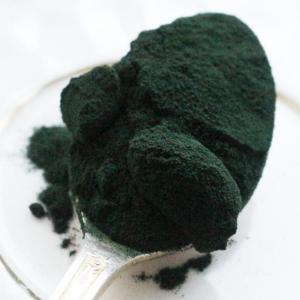 Spoon of green powder